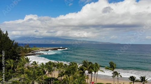 A view over breezy tradewinds and palms at Fleming Beach in Maui, hawai photo