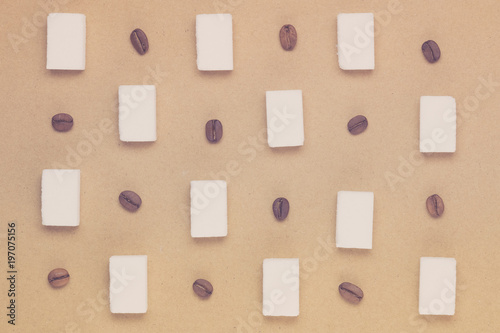 Flat lay of coffee beans and sugar cubes background