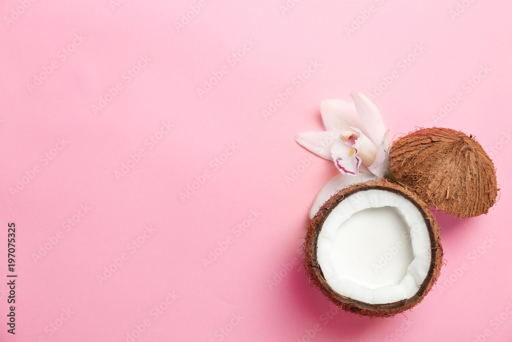 Nut with fresh coconut milk on color background