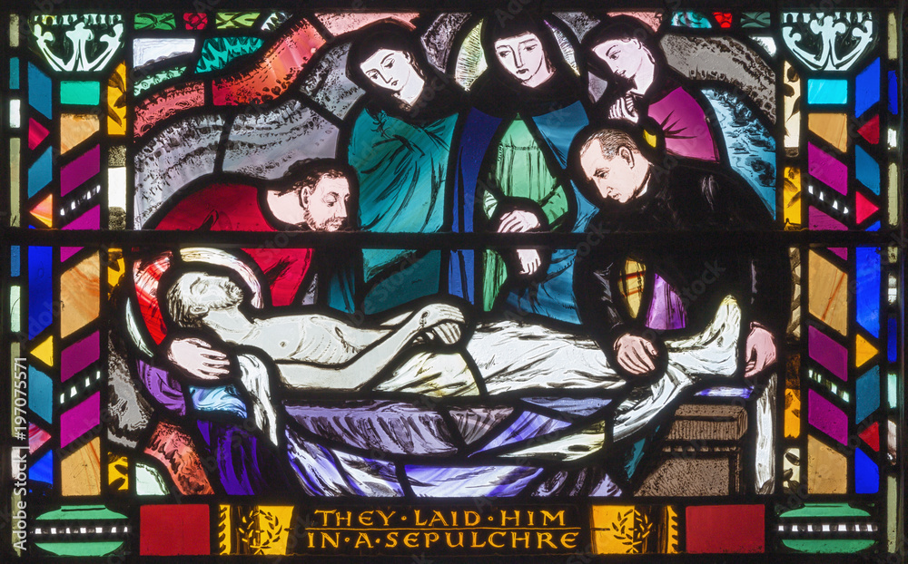 LONDON, GREAT BRITAIN - SEPTEMBER 16, 2017: The scene of the Burial of Jesus on the stained glass in church St Etheldreda by Charles Blakeman (1953 - 1953).