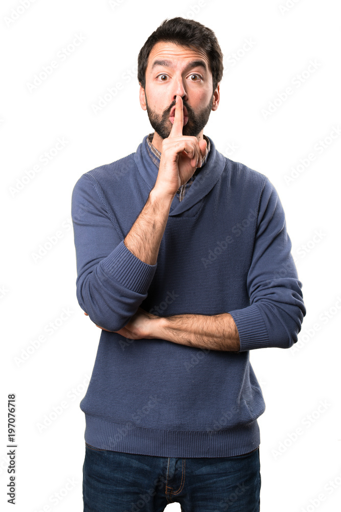 Handsome brunette man with beard making silence gesture on white background Handsome brunette man with beard making silence gesture on white background