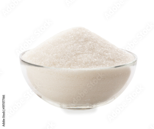 Glass bowl with pure sugar on white background