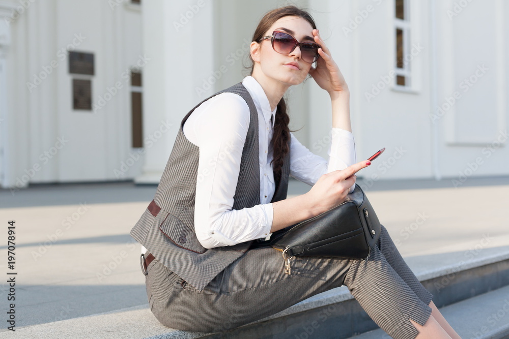  Woman business suit, handbag,  smart phone