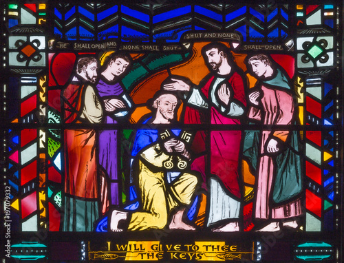 LONDON, GREAT BRITAIN - SEPTEMBER 16, 2017: The Christ Handing the Keys to St Peter on the stained glass in church St Etheldreda by Charles Blakeman (1953 - 1953).