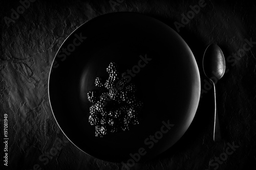 Blackberries on black plate