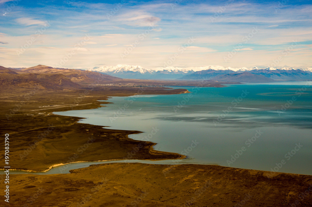 aerial view of El Calafate with its airport at Lago Argentina and the andes in the back, Patagonia, Argentina