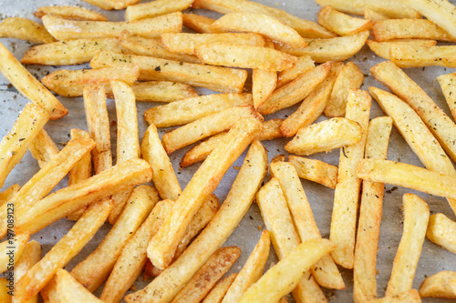 Homemade french fries on a tray background, closeup shot