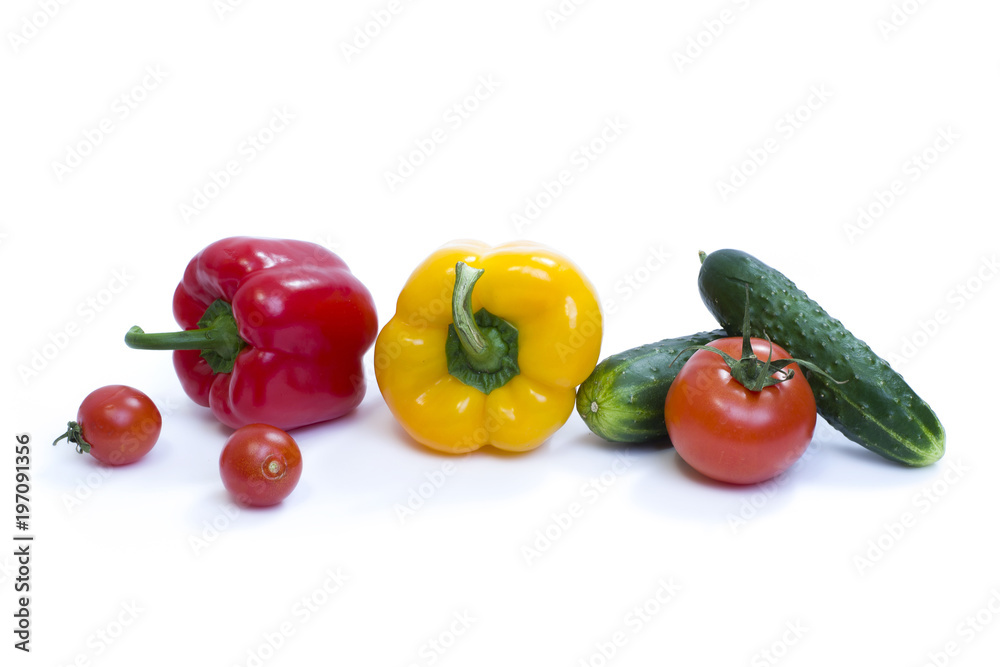 Red pepper with yellow pepper and tomatoes on a white background. Red pepper with yellow pepper and tomatoes on a white background.