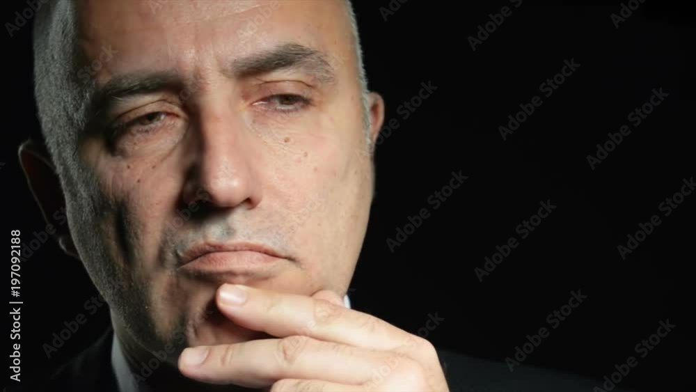 Close up video of thinking senior man Close up video of thinking senior man