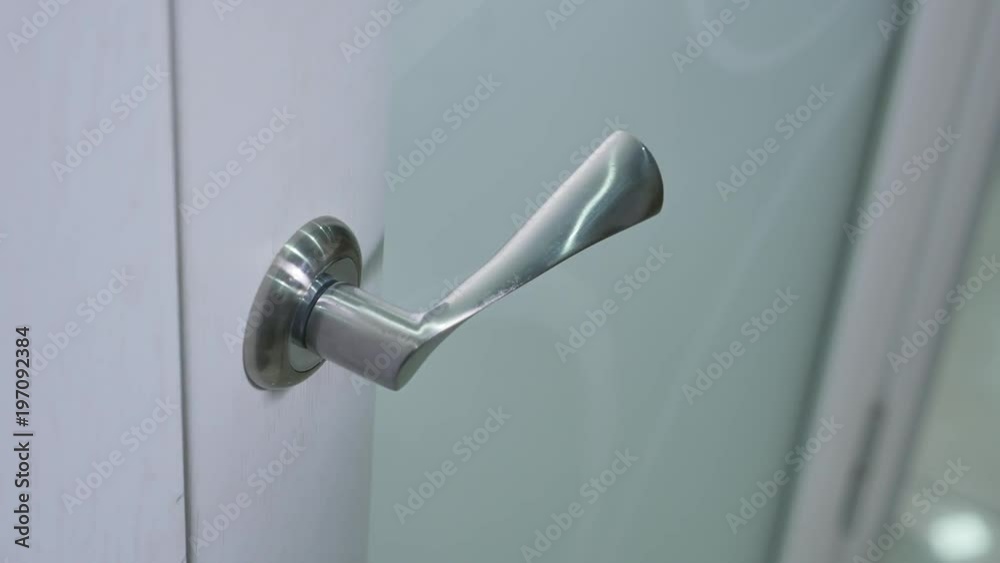 white door handle open close-up white door handle open close-up