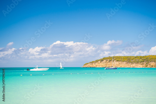 Boats on calm sea water in Antigua on sunny day. Water transport, sport, activity. Summer vacation on caribbean. Wanderlust, travel, trip. Adventure, discovery, journey
