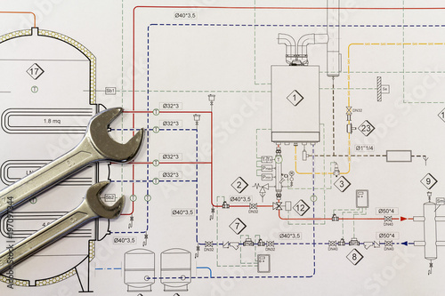 Fotografie Maintenance and service: Wrench and project drawings with plumbing system