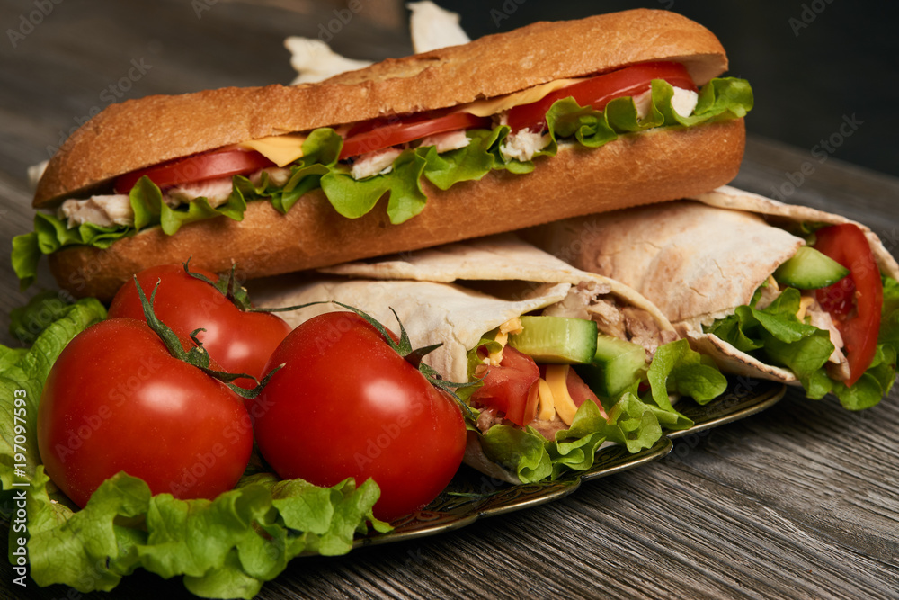 Burrito with grilled chicken and vegetables, Shawarma Sandwich, Doner Kebab, Chicken Shawarma, Subway sandwich on wooden table Burrito with grilled chicken and vegetables, Shawarma Sandwich, Doner Kebab, Chicken Shawarma, Subway sandwich on wooden table