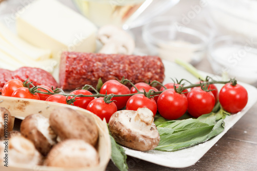 Food ingredients for pizza on table