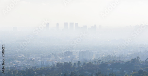  Downtown skyscrapers silhouettes of city of Los Angeles. Poor visibility, smog, caused by air pollution.