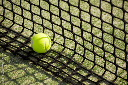 ball tennis on track with network and space for text © charlymorlock