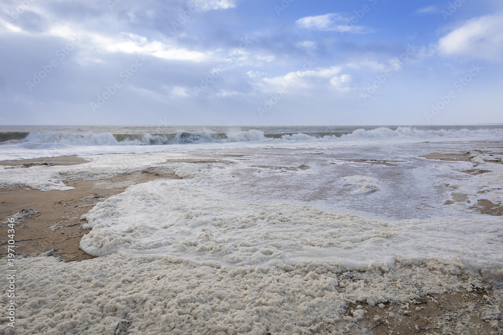 beach with sea foam before the storm Carmen hits the coast of La Faute Sur Mer, Vendee, France beach with sea foam before the storm Carmen hits the coast of La Faute Sur Mer, Vendee, France