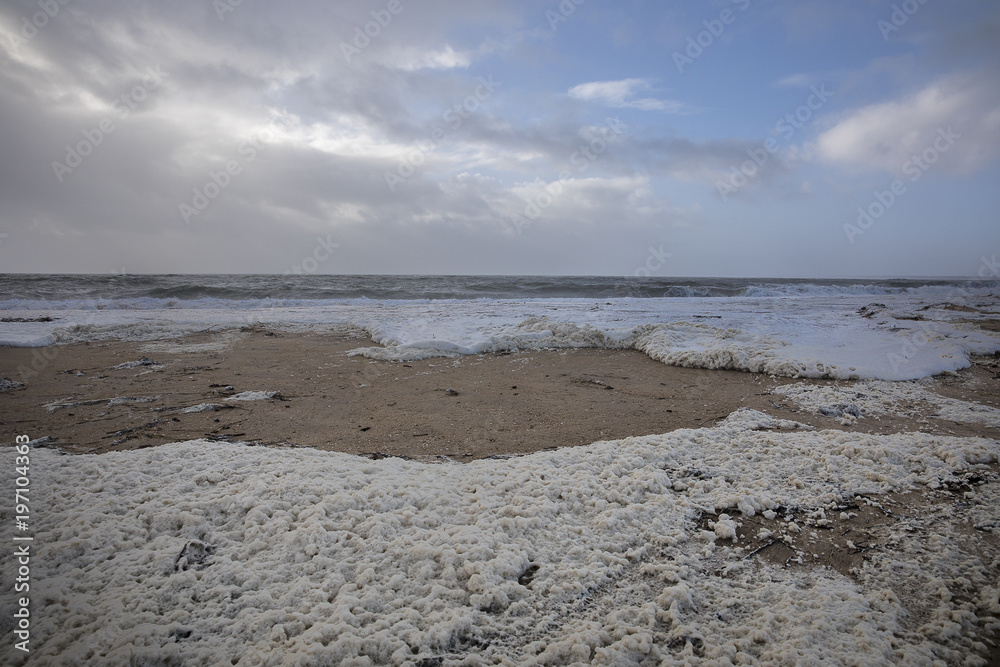 beach with sea foam before the storm Carmen hits the coast of La Faute Sur Mer, Vendee, France beach with sea foam before the storm Carmen hits the coast of La Faute Sur Mer, Vendee, France