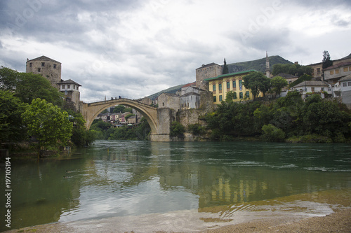 View of the single-arch Old Bridge or Stari Most Neretva over River in Mostar, Bosnia and Herzegovina. The Old Bridge was destroyed in 1993 by Croat military forces during the Croat–Bosniak War. 