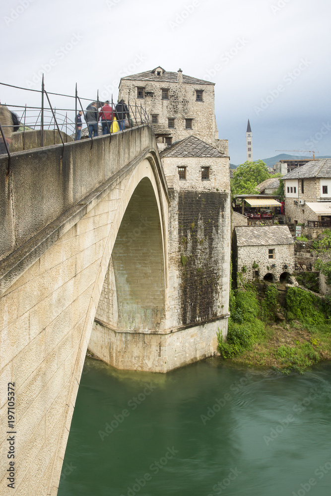 View of the single-arch Old Bridge or Stari Most Neretva over River in Mostar, Bosnia and Herzegovina. The Old Bridge was destroyed in 1993 by Croat military forces during the Croat–Bosniak War. View of the single-arch Old Bridge or Stari Most Neretva over River in Mostar, Bosnia and Herzegovina. The Old Bridge was destroyed in 1993 by Croat military forces during the Croat–Bosniak War.