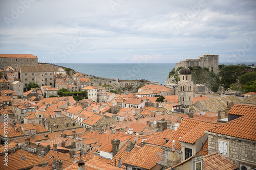 View over the orange rooftops of old town Dubrovnik from the ancient city wall with cloudy weather, Croatia