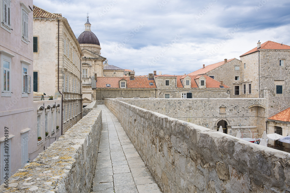 walkway path on the old city wall of Dubrovnik, Croatia with view on the cityscape