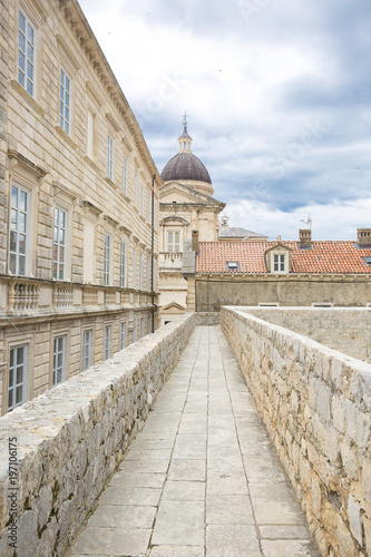 walkway path on the old city wall of Dubrovnik, Croatia with view on the cityscape