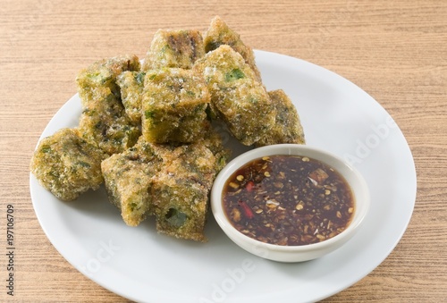 Fried Steamed Garlic Chives Dumpling Served with Soy Sauce photo