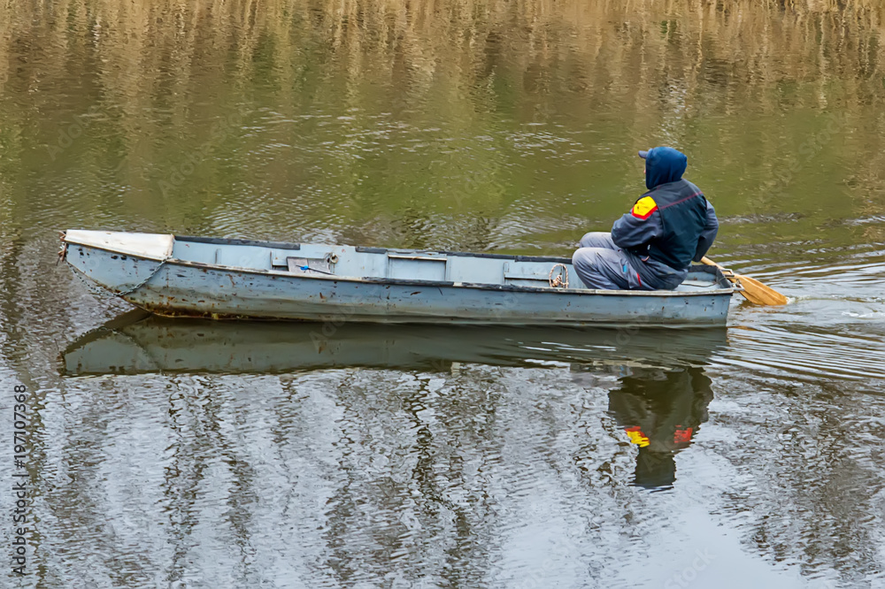 Naklejka premium Novi Sad, Serbia March 18, 2018: Boatman oars on the Danube-Tisa-Danube canal 