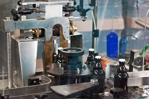 Bottles on the conveyor line as part of beer production at the brewery.