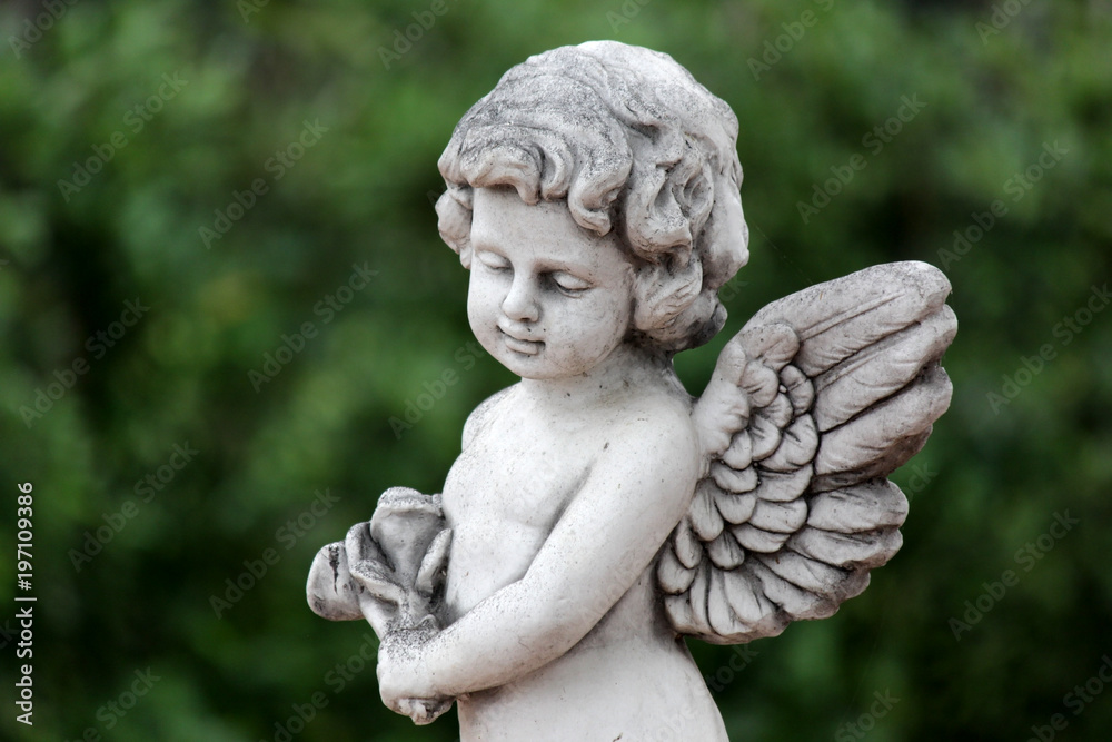 statue of an cute infant angel (cupid)