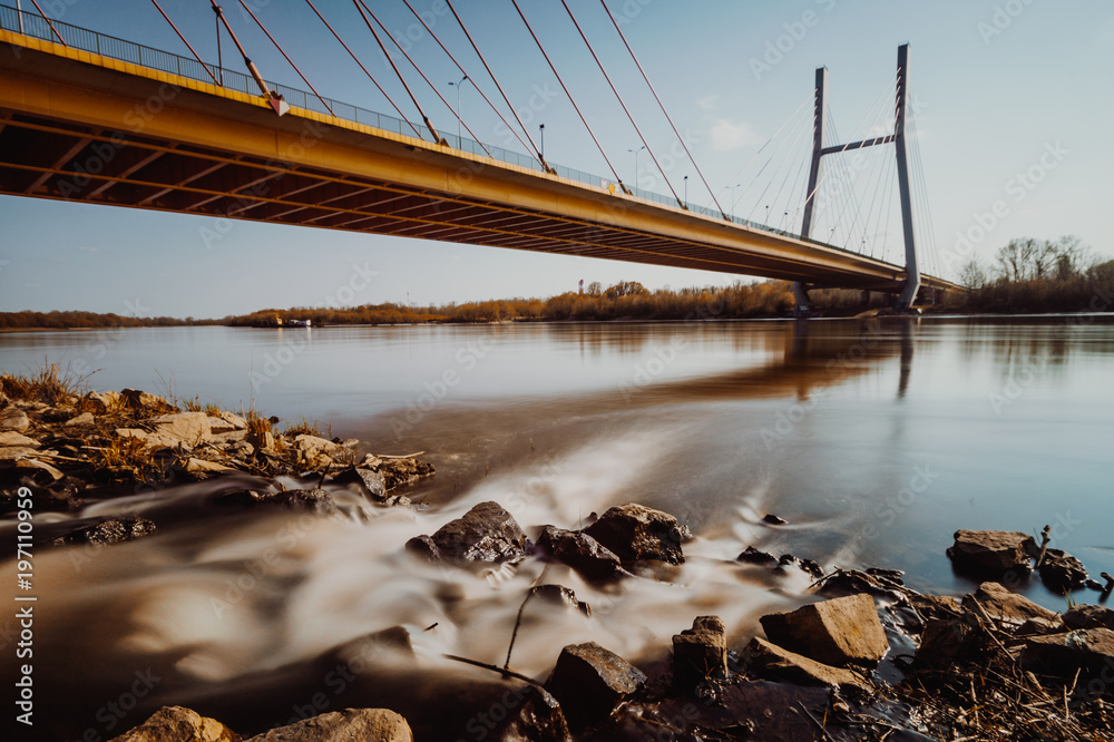 Car bridge over river in city