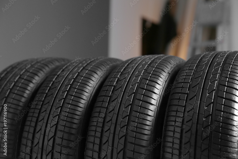 Car tires in automobile service center, closeup Car tires in automobile service center, closeup