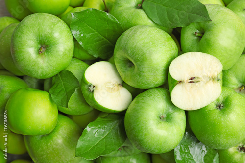 Fresh green apples as background