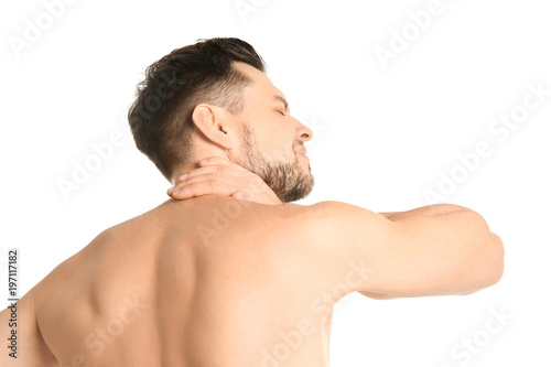Young man suffering from neck pain on white background