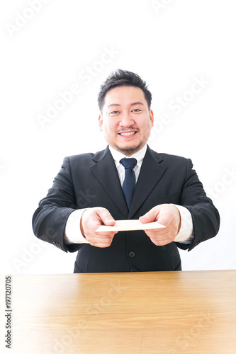 Businessman submitting a letter of resignation 