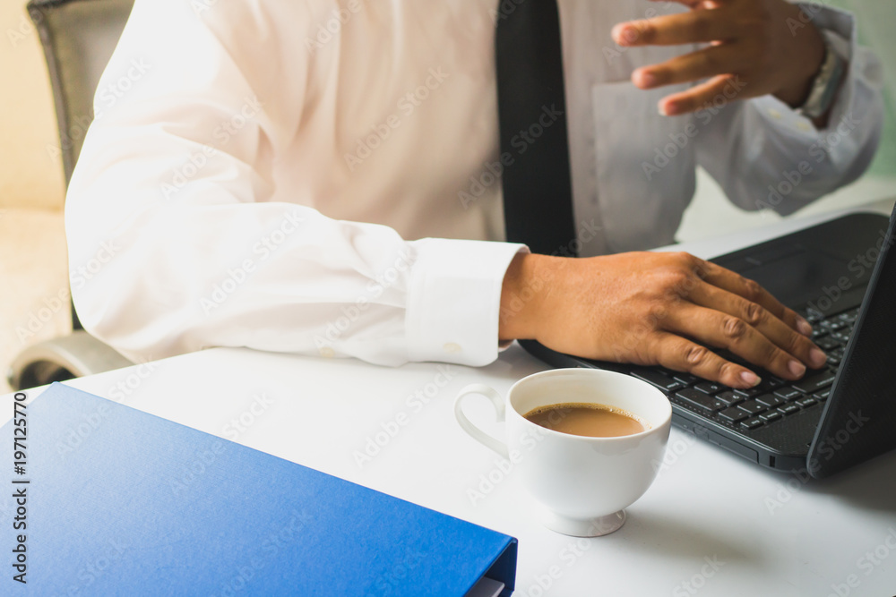 Businessmen who are committed to working with coffee in the morning.