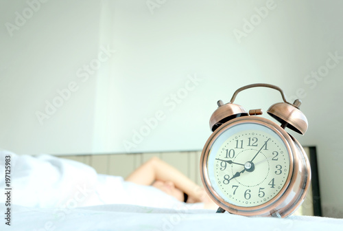 Morning holiday of a new day, alarm clock man sleep the room . Health concept.