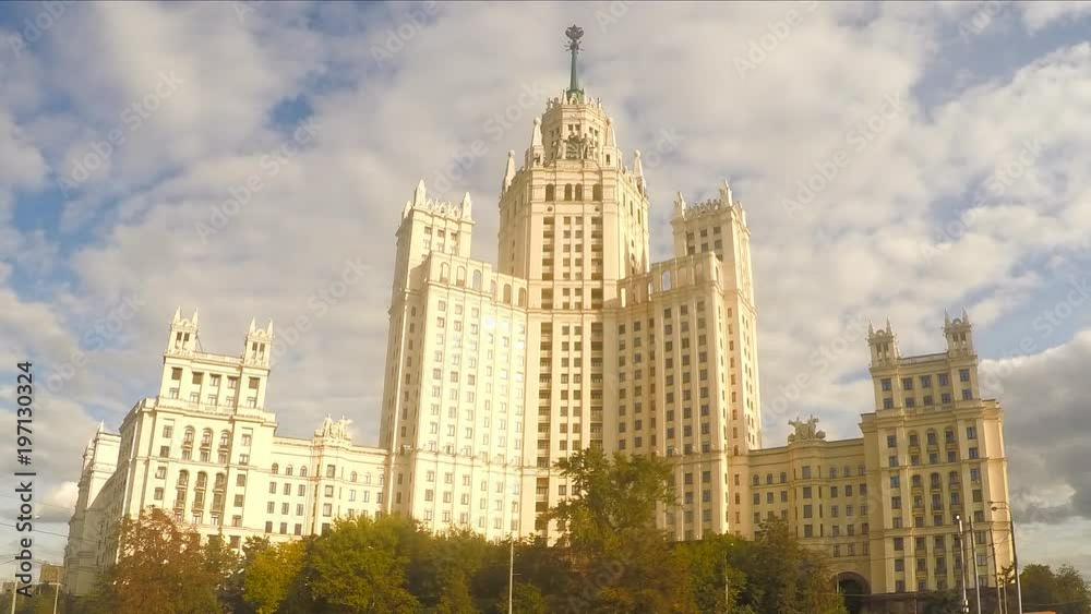 white stone skyscraper near the river in summer timelapse white stone skyscraper near the river in summer timelapse