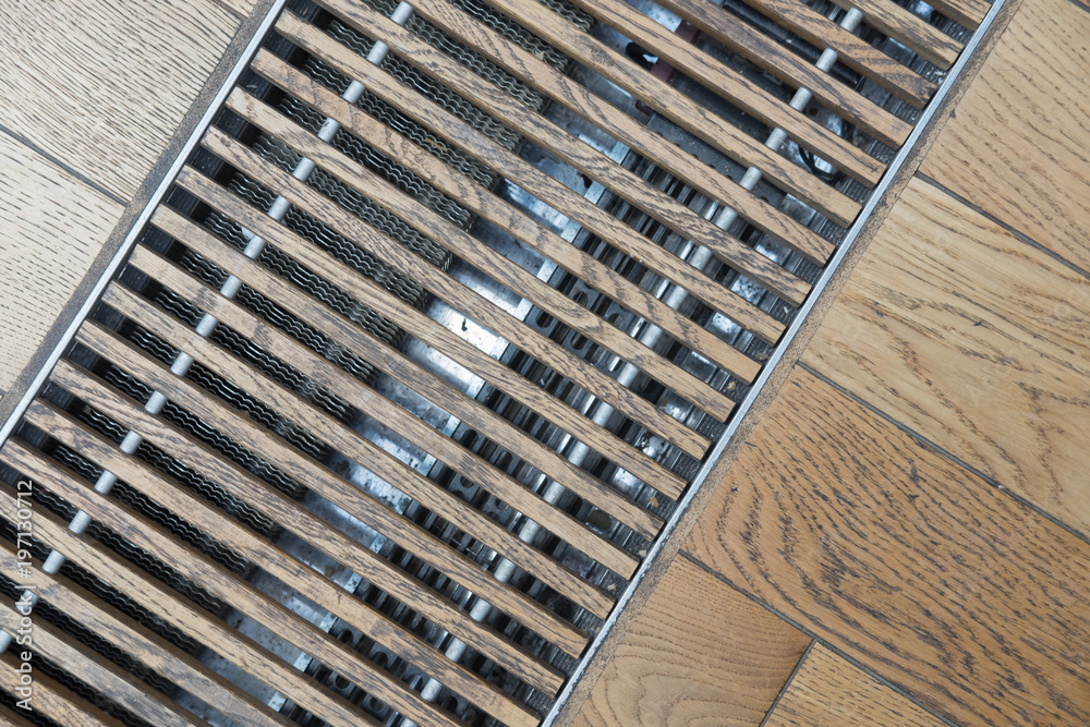 House drain grates, ventilation gratings, wooden floor. Stock Photo
