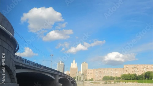 houses on the river bank and bridge timelapse
