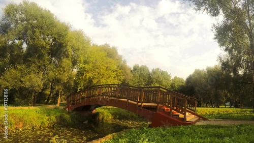 park and bridge over the small river timelapse