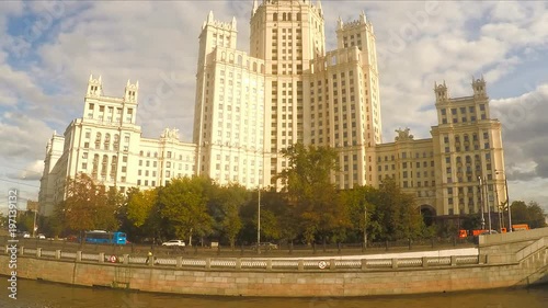 white stone skyscraper near the river timelapse