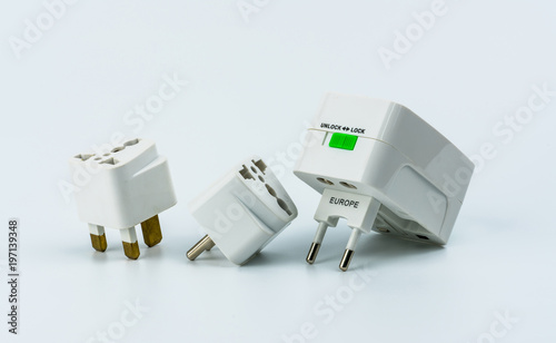 Foto Set of universal plug adapters for travel around the world isolated on white background
