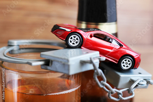 Toy car and bottle drinking and driving concept