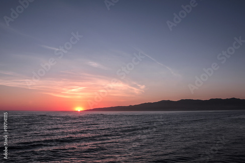 Beautiful sunset view from the pier at Santa Monica beach, Los Angeles, California, USA.