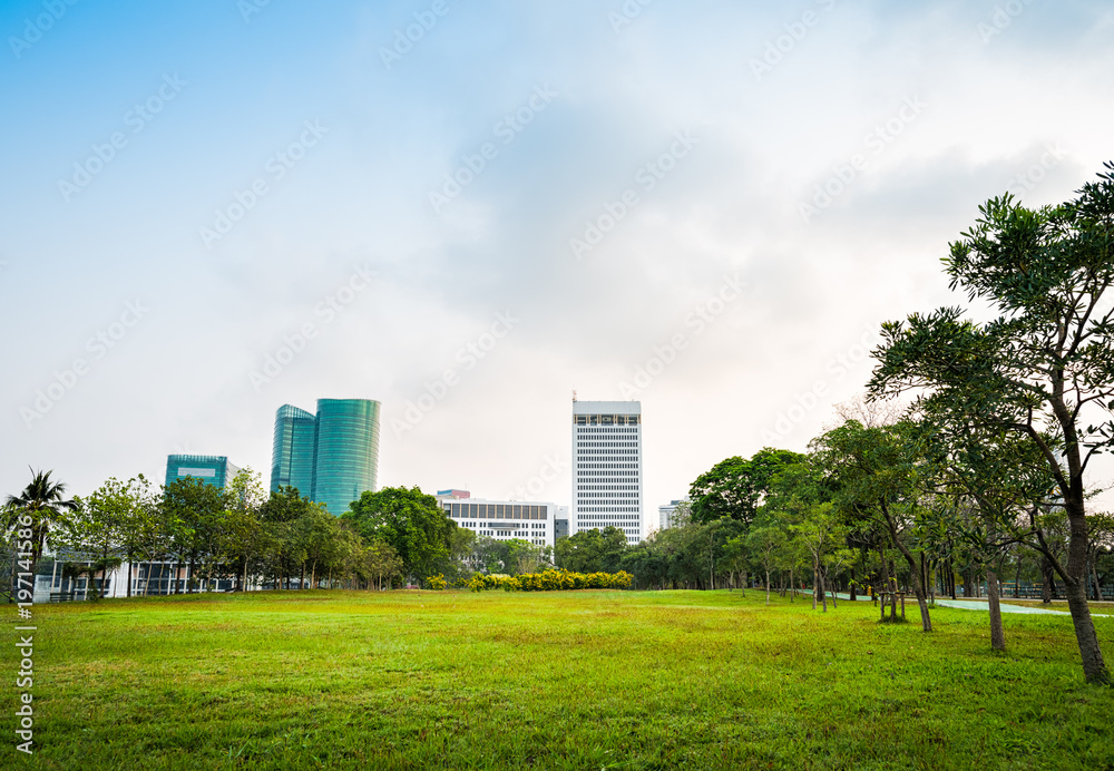 Green grass field with building in Public Park