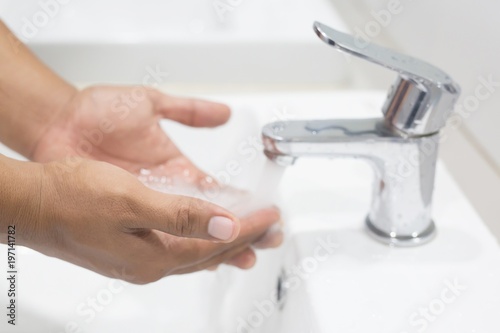 Hygiene. Cleaning Hands. Washing hands with soap under the faucet with water Pay dirt. 