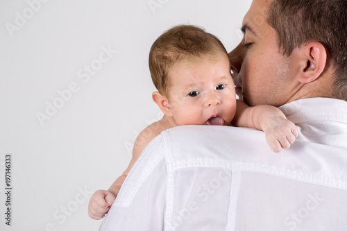 Father kisses baby