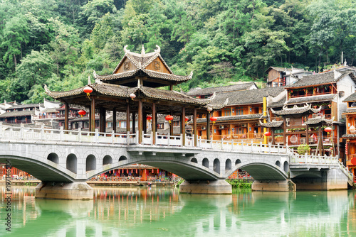 Bridge and traditional Chinese riverside buildings in Fenghuang photo